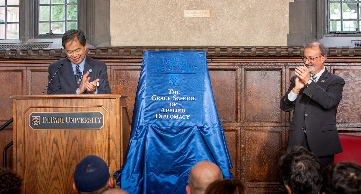 A. Gabriel Esteban, Ph. D., left, president of DePaul University and Guillermo Vásquez de Velasco, dean of the College of Liberal Arts and Social Sciences, inaugurate The Grace School of Applied Diplomacy. (DePaul University/Randall Spriggs)